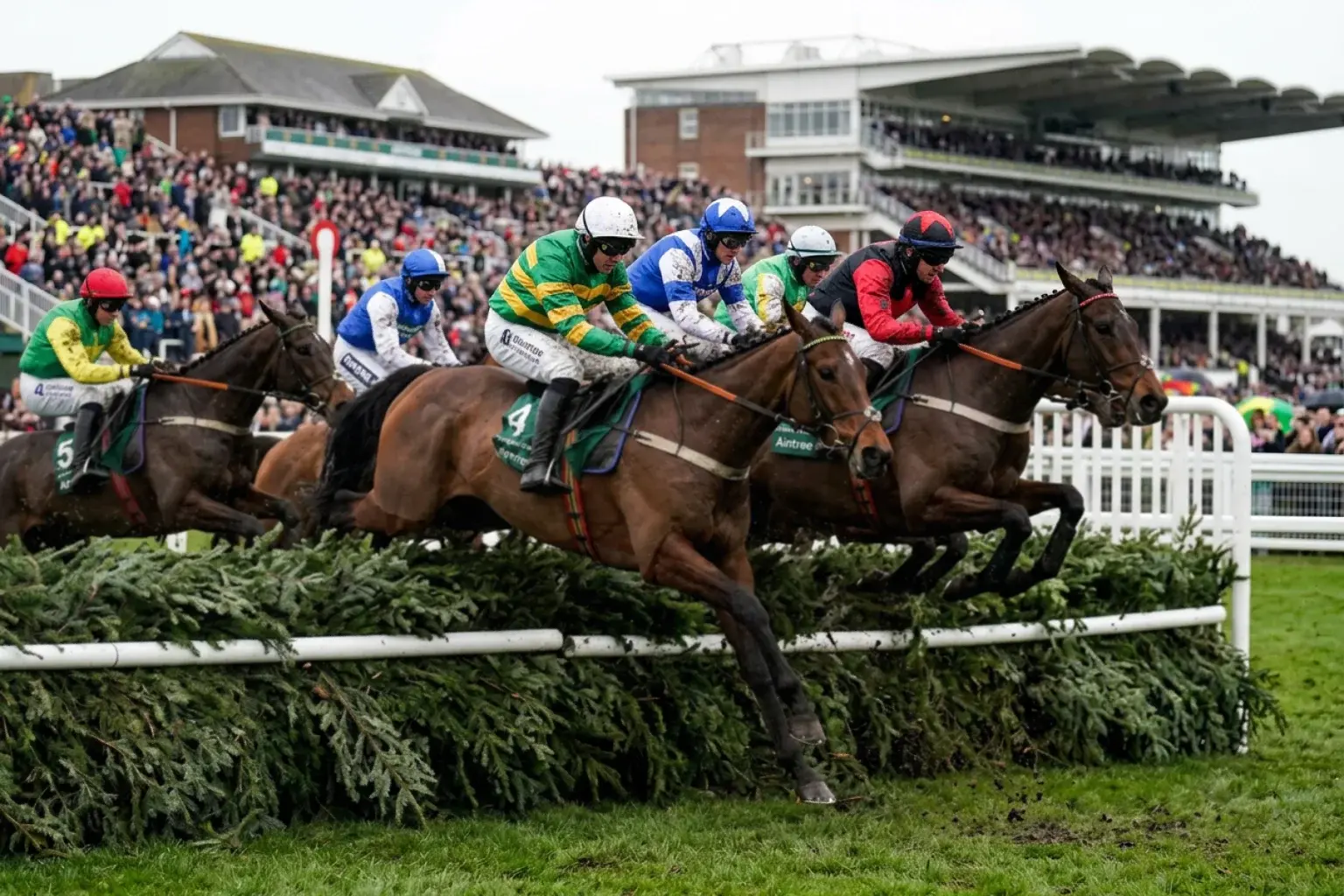 Horses jumping the famous Aintree fences during the Grand National